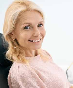 Patient in Virginia Beach smiling with dentures