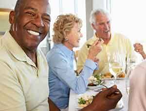 Patient in Virginia Beach with dentures socializing